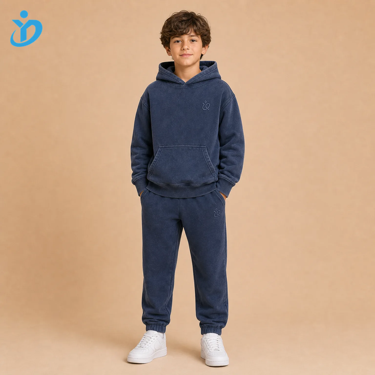 Custom boys embroidered tracksuit set front view with washed navy hoodie, jogger pants, premium embroidered logo, garment wash soft hand feel and Dongguan Yidi Clothing Co Ltd transparent logo.