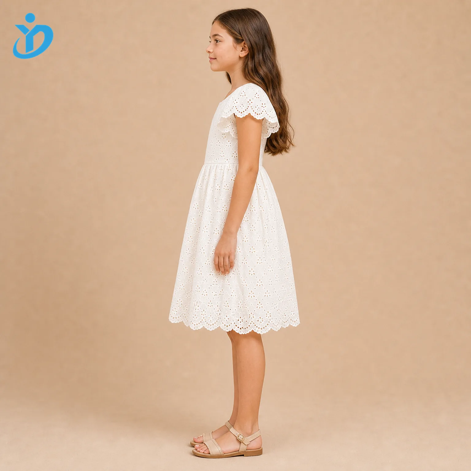 Full body side view of custom girls broderie anglaise dress showing all-over eyelet embroidery, cotton embroidery, scalloped hem, lace edge, A-line silhouette and Dongguan Yidi Clothing Co Ltd transparent logo