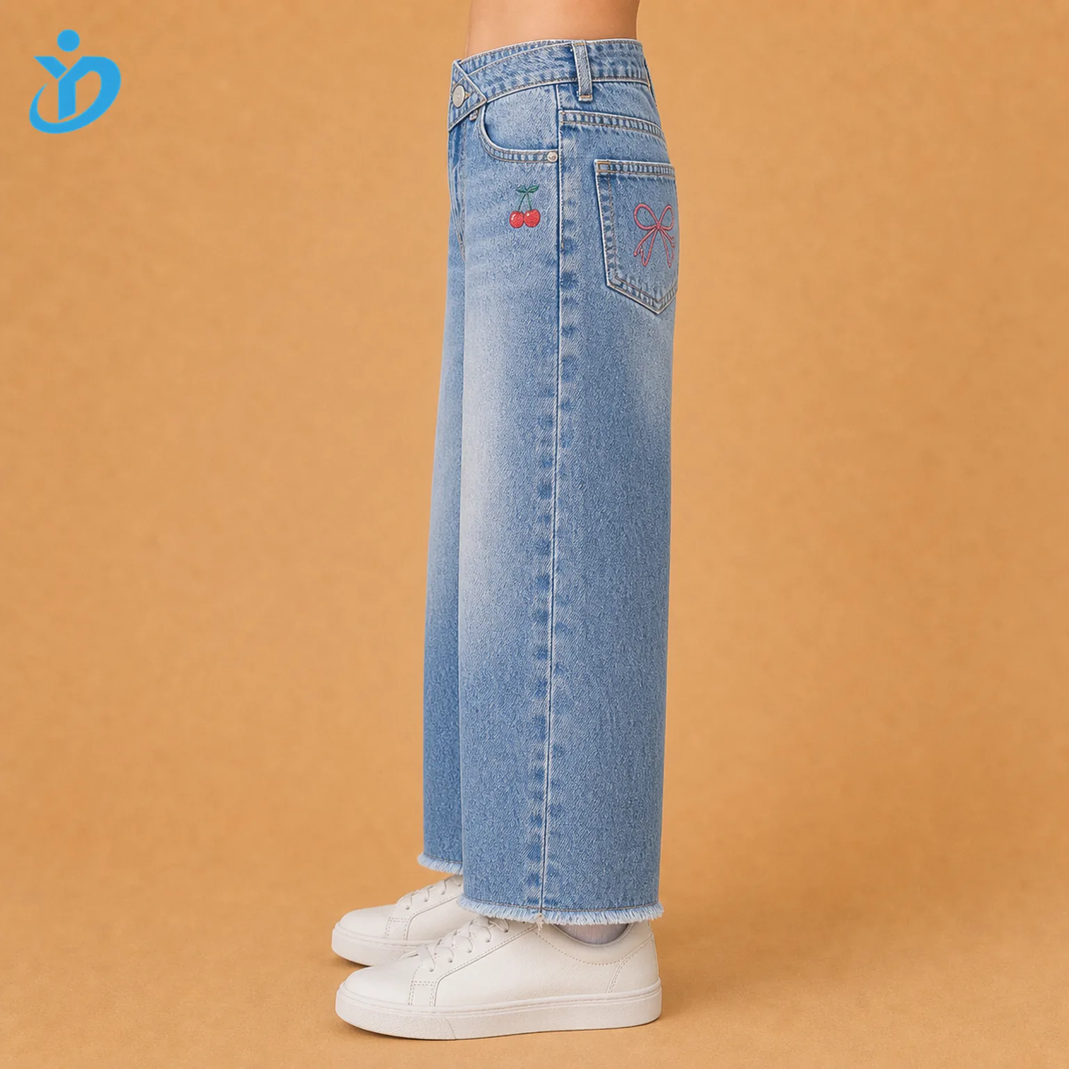 Lower body side view of custom girls wide leg denim jeans showing wide leg silhouette, snow wash denim, crossover waist edge, small cherry detail and Dongguan Yidi Clothing Co Ltd transparent logo