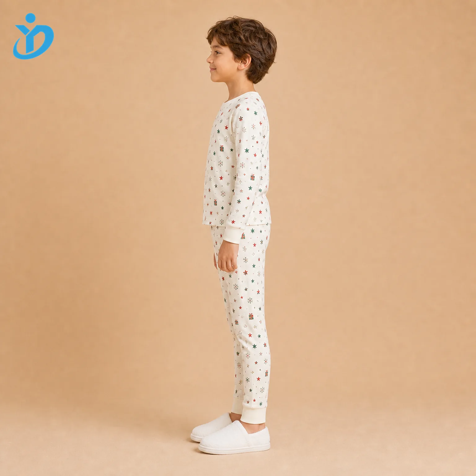 Custom kids all-over print pajama set side view with cream cotton jersey, DTG holiday print, long sleeve top, full-length pants and Dongguan Yidi Clothing Co Ltd transparent logo.