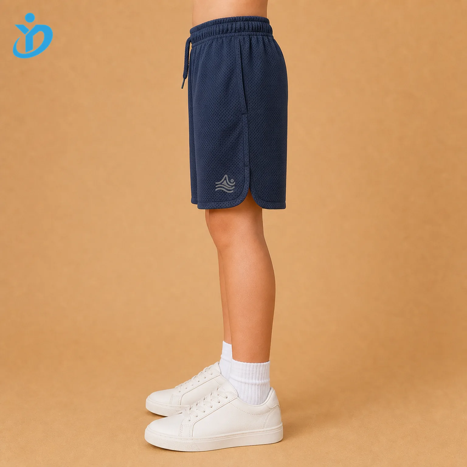 Lower body side view of custom kids athletic shorts showing breathable mesh fabric, side seam, side vent, elastic waist and Dongguan Yidi Clothing Co Ltd transparent logo