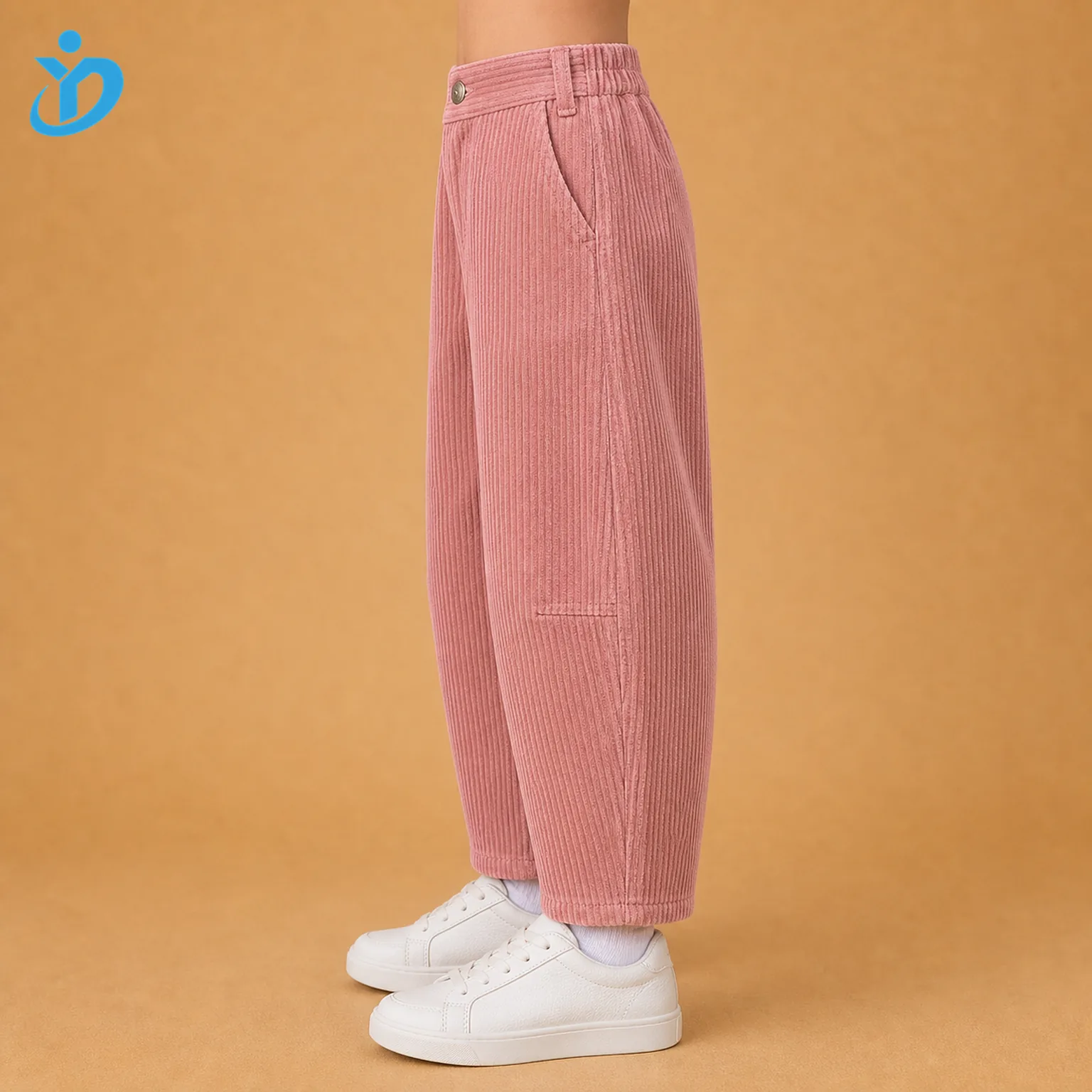 Lower body side view of custom kids corduroy barrel leg pants showing rose pink wide wale corduroy, curved side seam, tapered ankle and Dongguan Yidi Clothing Co Ltd transparent logo