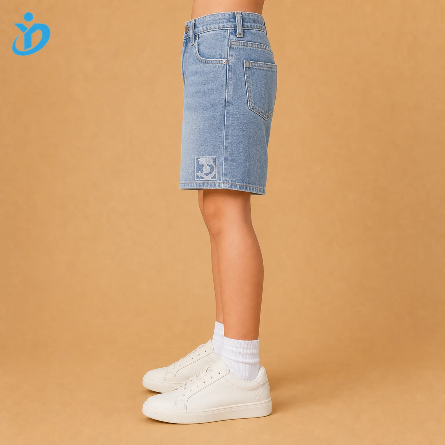 Lower body side view of custom kids denim shorts showing stone wash denim, side seam, printed patch, relaxed kids fit and Dongguan Yidi Clothing Co Ltd transparent logo
