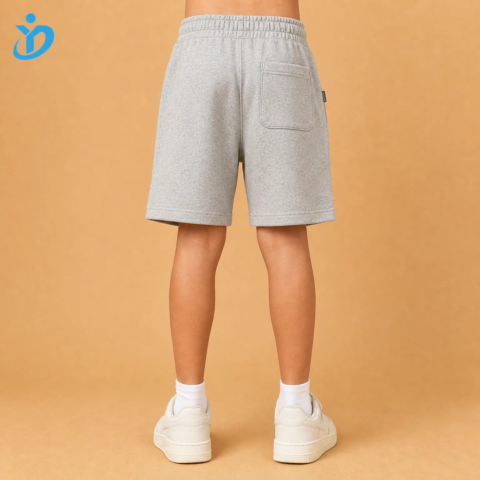 Lower body back view of custom kids French terry shorts with elastic waistband, back pocket, soft French terry fabric and Dongguan Yidi Clothing Co Ltd transparent logo