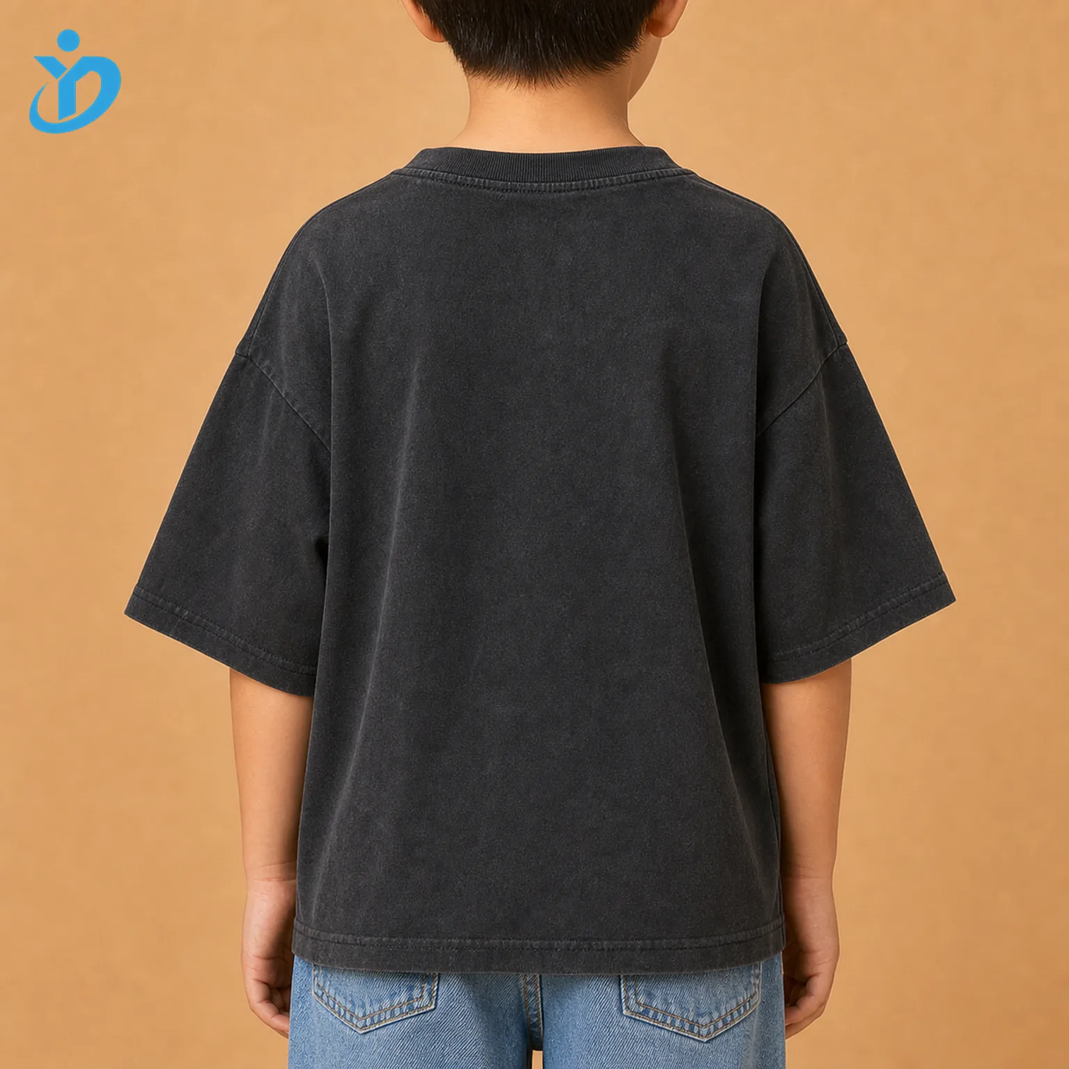 Upper body back view of custom kids oversized graphic T shirt with washed charcoal back panel drop shoulder oversized silhouette wide sleeves and Dongguan Yidi Clothing Co Ltd transparent logo