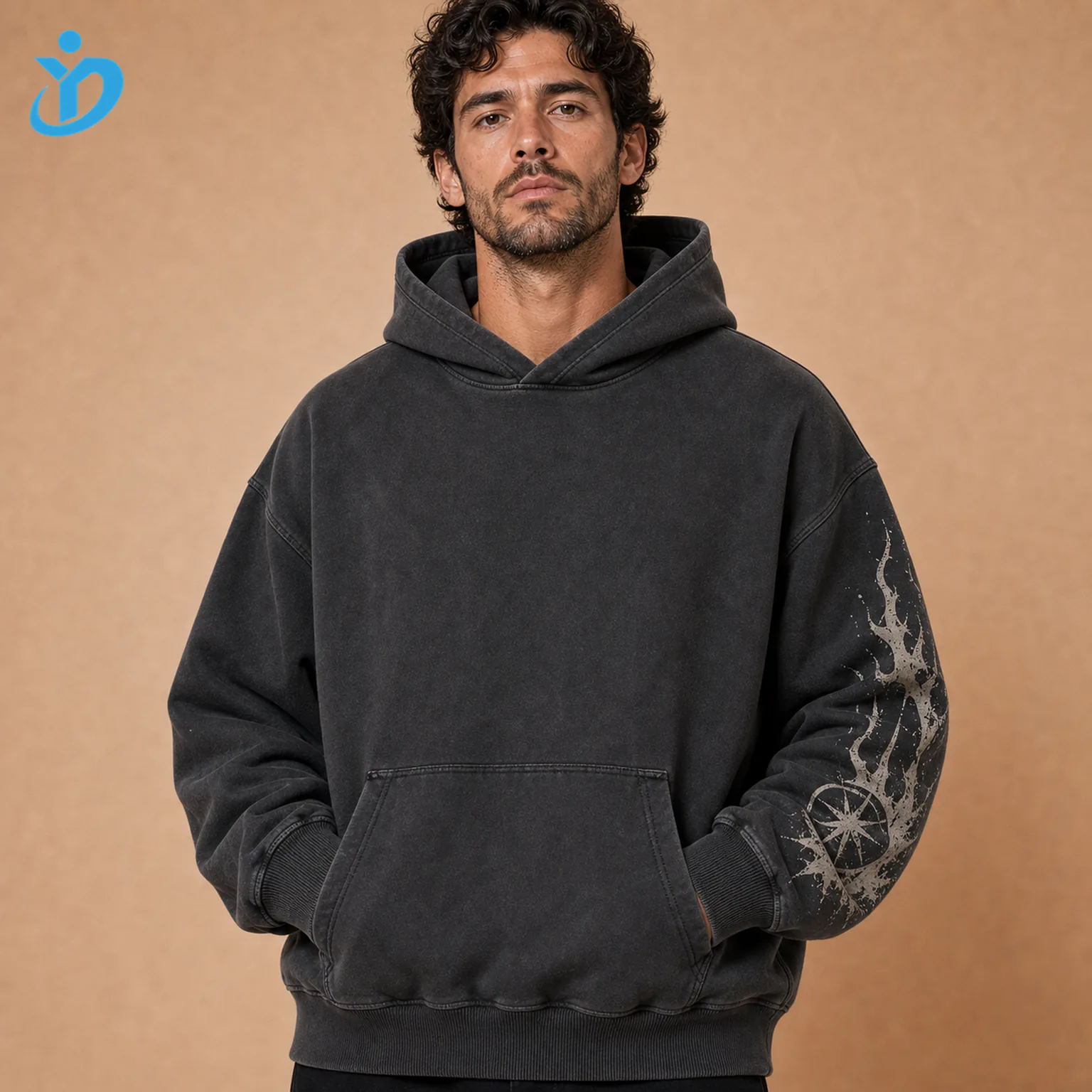 Upper body front view of custom mens heavyweight pullover hoodies in washed charcoal black with oversized fit double-layer three-piece hood kangaroo pocket sleeve print and Dongguan Yidi Clothing Co Ltd transparent logo