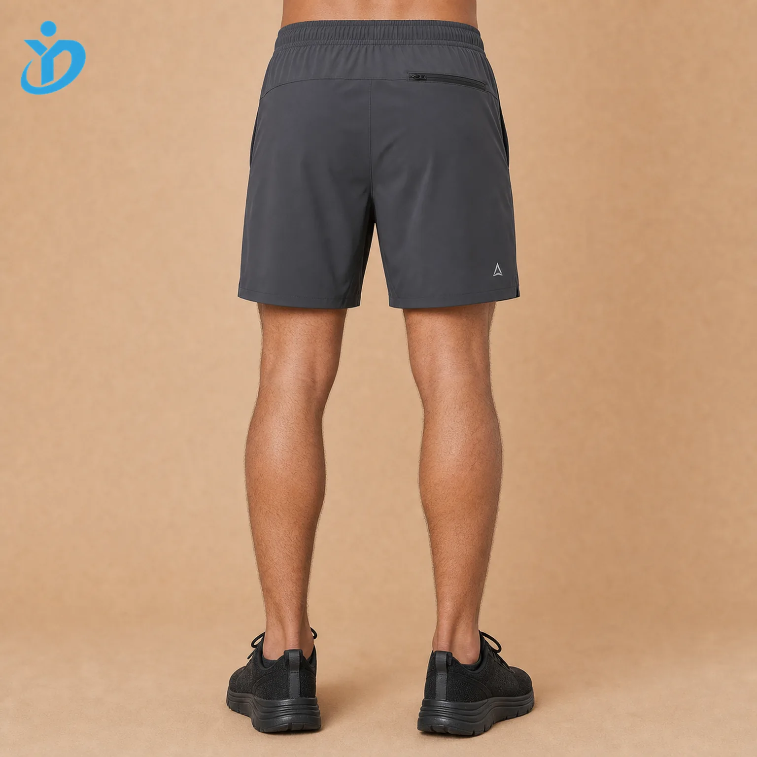 Lower body back view of custom mens hybrid shorts showing elastic waist back zip pocket lightweight woven fabric quick dry finish reflective logo and Dongguan Yidi Clothing Co Ltd transparent logo