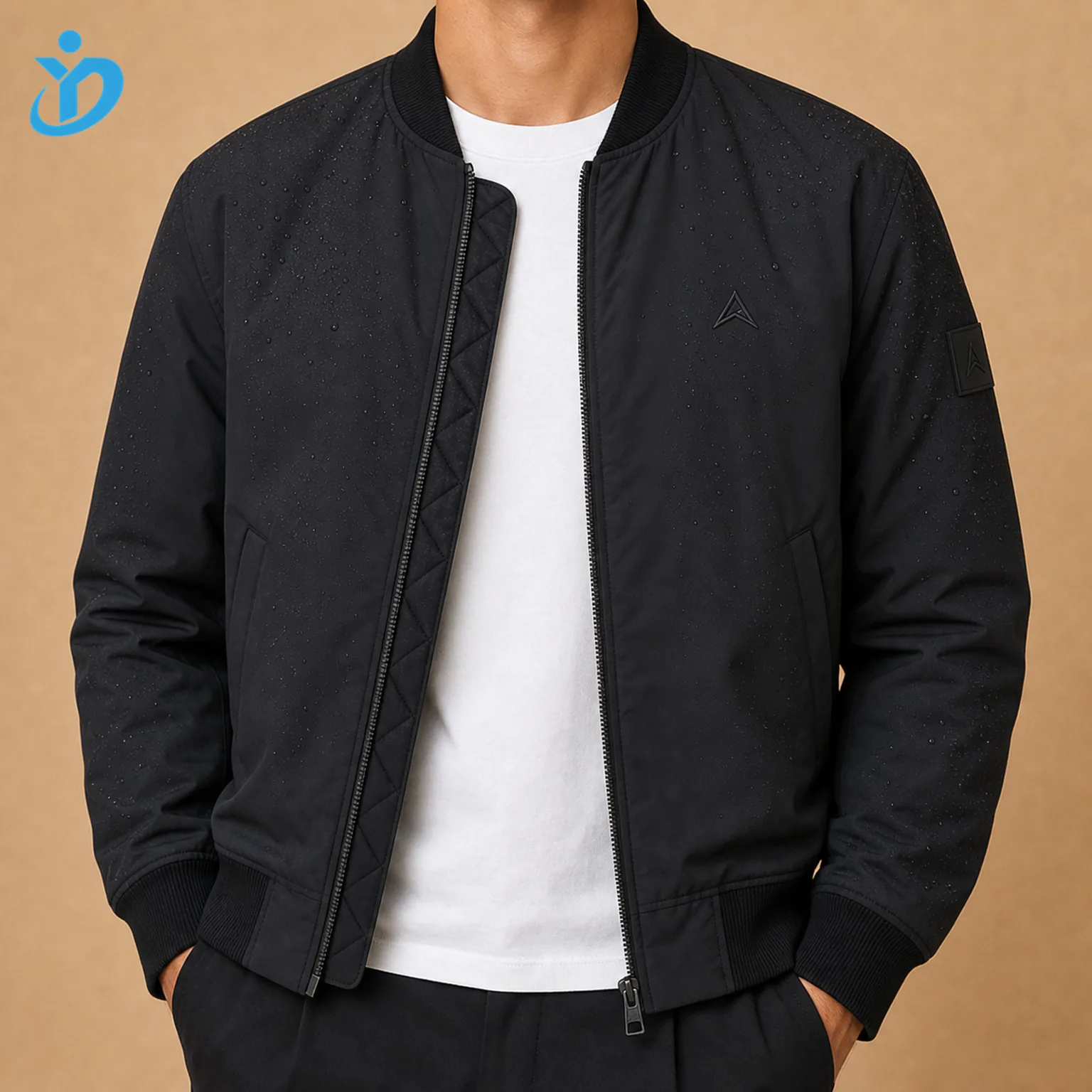 Upper body front view of custom mens recycled nylon bomber jacket with water repellent black shell quilted lining tonal embroidery logo silicone sleeve patch rib trims and Dongguan Yidi Clothing Co Ltd transparent logo