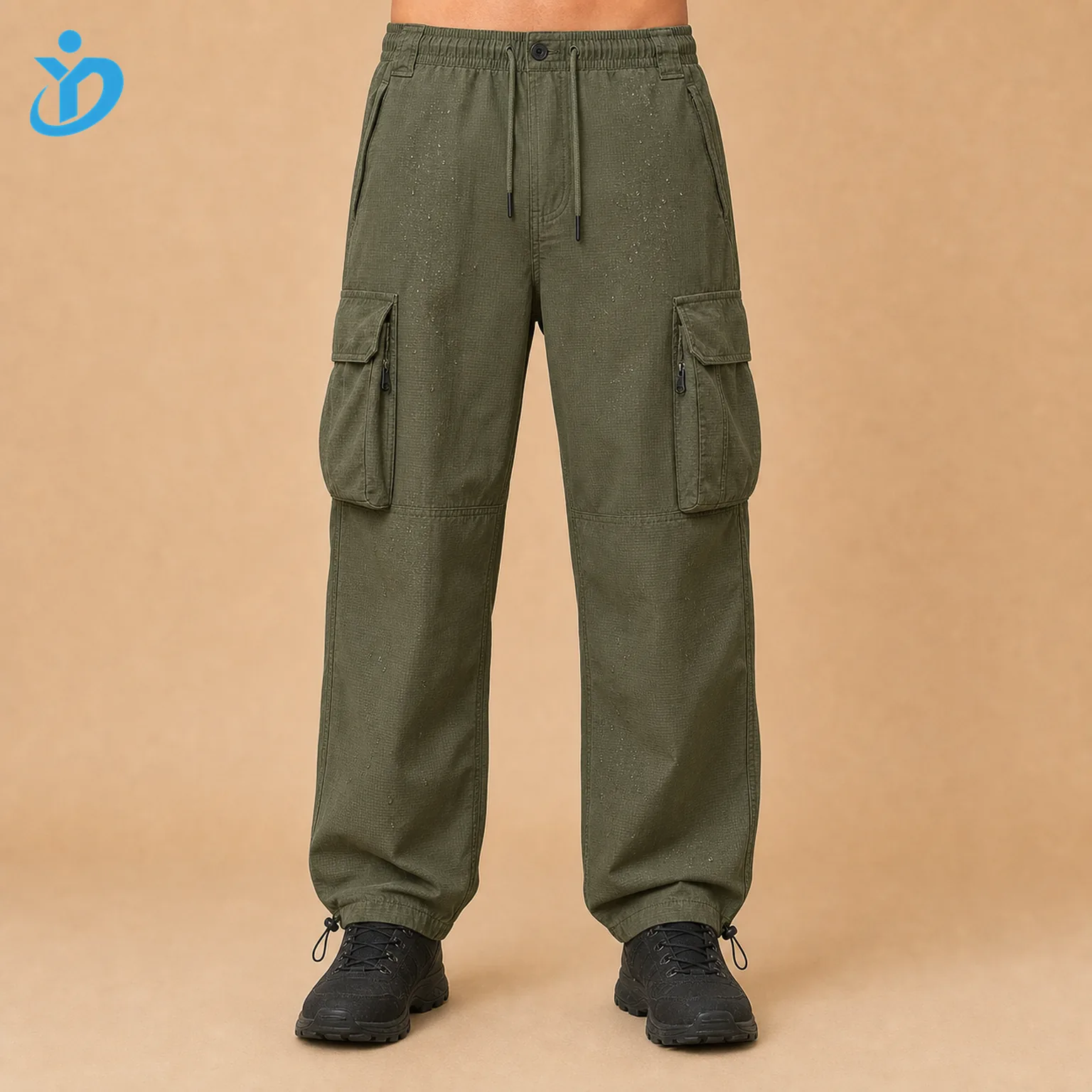 Lower body front view of custom mens olive green ripstop cargo pants with large cargo pockets hidden zippers adjustable hem garment washed water resistant finish reinforced stitching and Dongguan Yidi Clothing Co Ltd transparent logo