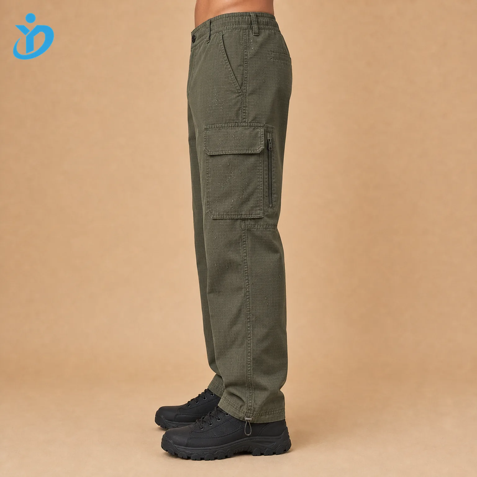 Lower body side view of custom mens olive green ripstop cargo pants showing large cargo pocket hidden zipper adjustable ankle hem garment washed fabric reinforced stitching and Dongguan Yidi Clothing Co Ltd transparent logo