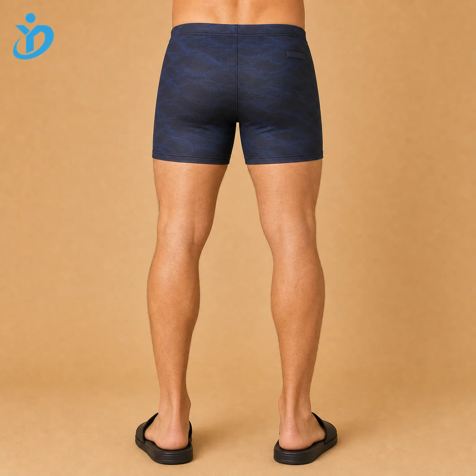Lower body back view of custom mens square leg swim shorts with dark navy black sublimation print UPF50 plus chlorine durable fabric flatlock rear seams and Dongguan Yidi Clothing Co Ltd transparent logo