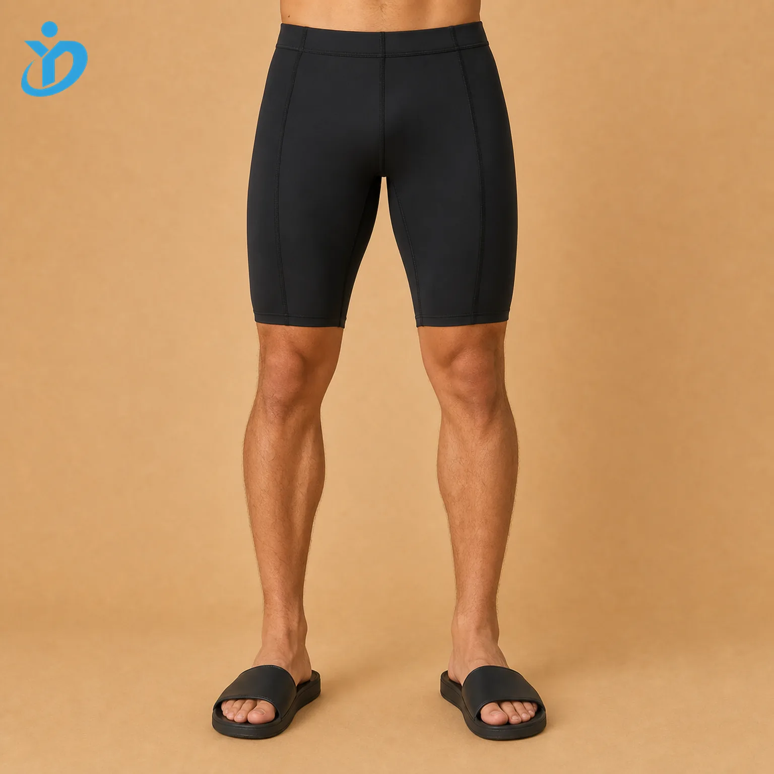 Lower body front view of custom mens swim jammers with black compression fit flatlock stitching four needle six thread no friction seams UPF50 plus chlorine resistant fabric and Dongguan Yidi Clothing Co Ltd transparent logo