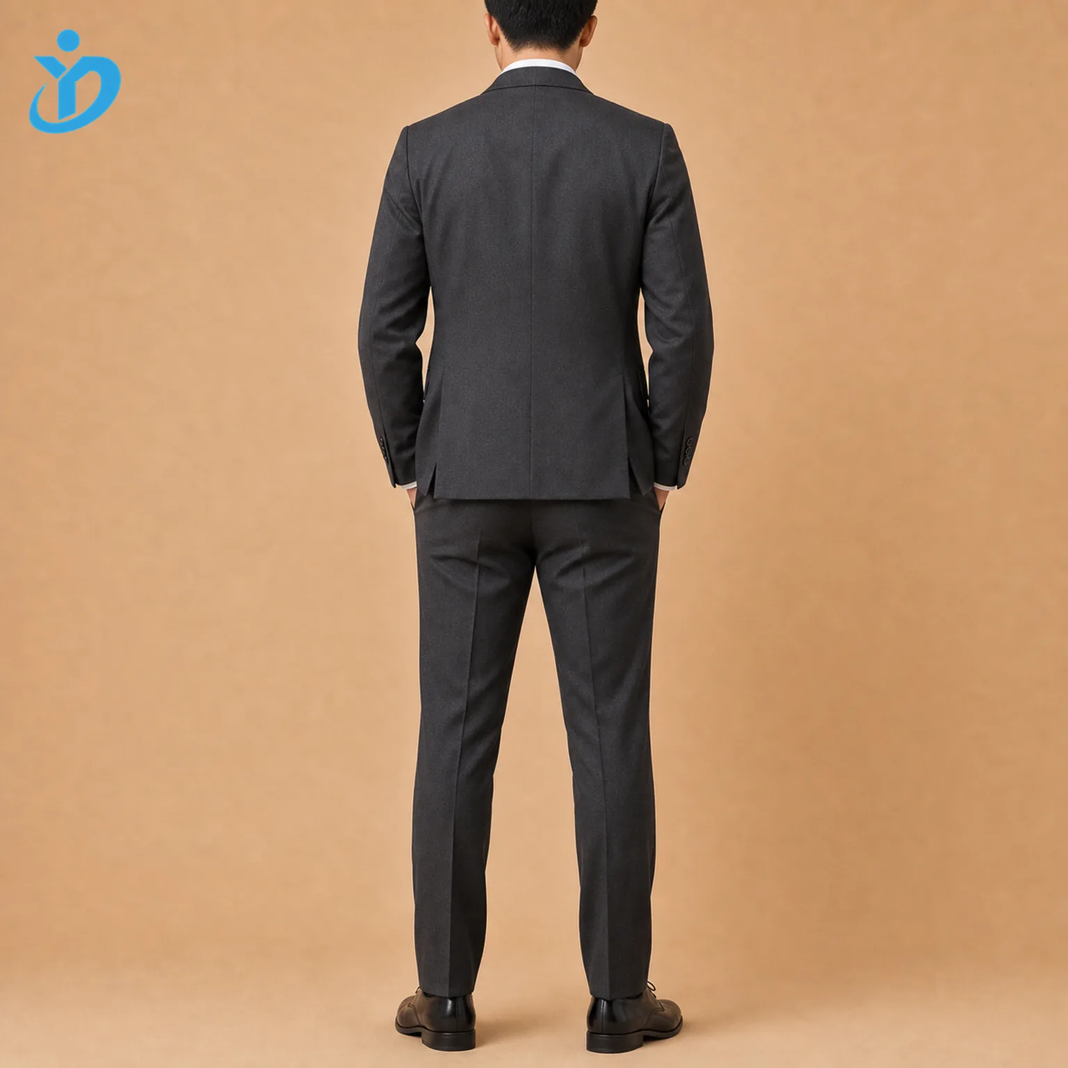 Full body back view of custom mens three piece wedding suit with dark charcoal tailored jacket double vents flat front trousers black dress shoes and Dongguan Yidi Clothing Co Ltd transparent logo