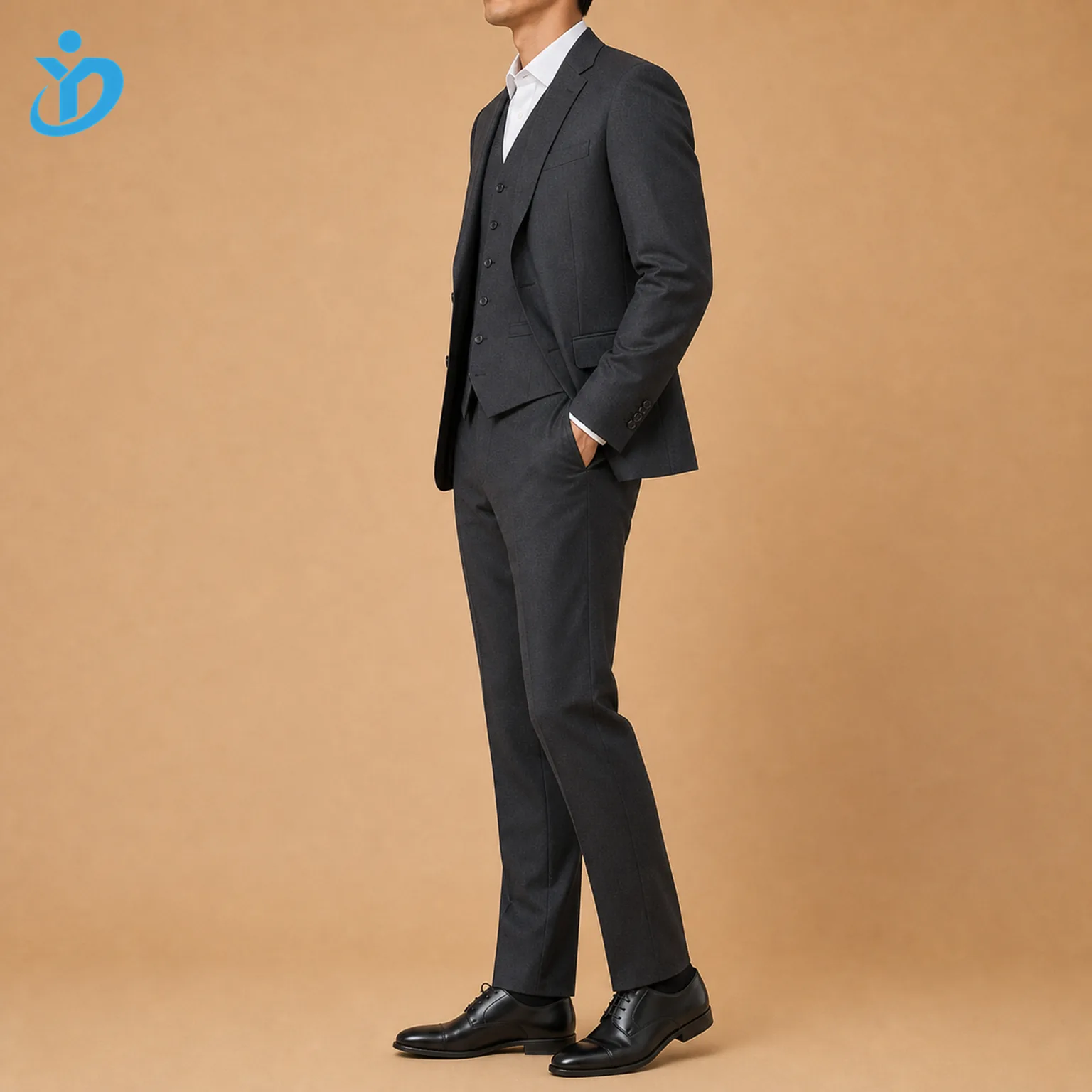 Full body side view of custom mens three piece wedding suit showing dark charcoal two button jacket matching waistcoat flat front trousers tailored profile black shoes and Dongguan Yidi Clothing Co Ltd transparent logo
