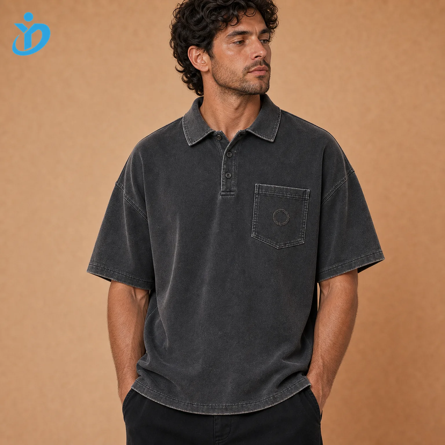 Upper body front view of custom mens vintage washed polo shirts in stone washed faded charcoal black pure cotton pique with slight boxy fit vintage wide collar three button placket chest pocket raw edge applique embroidery and Dongguan Yidi Clothing Co Ltd transparent logo