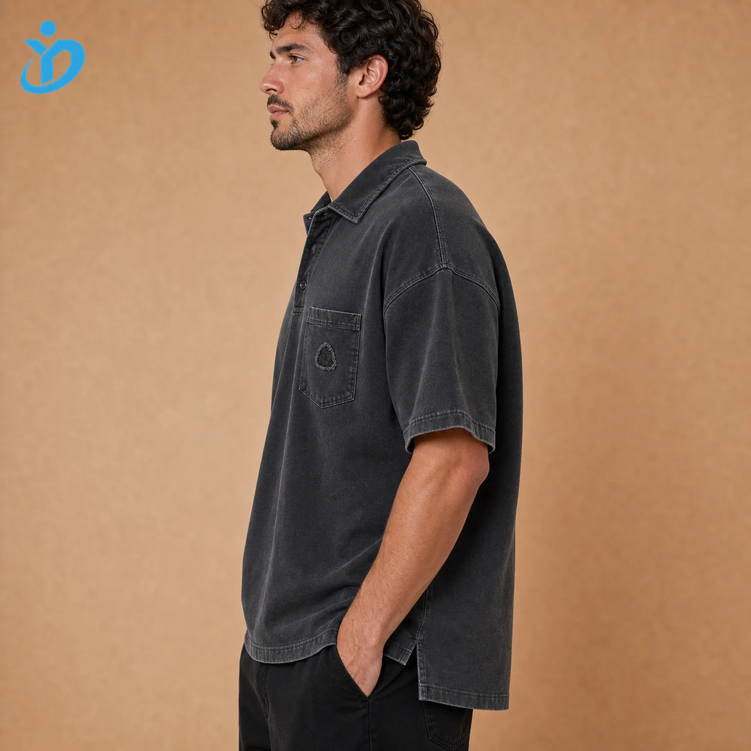 Upper body side view of custom mens vintage washed polo shirts showing slight boxy fit stone wash cotton pique left chest pocket extended sleeve cuff high low hem side slit and Dongguan Yidi Clothing Co Ltd transparent logo