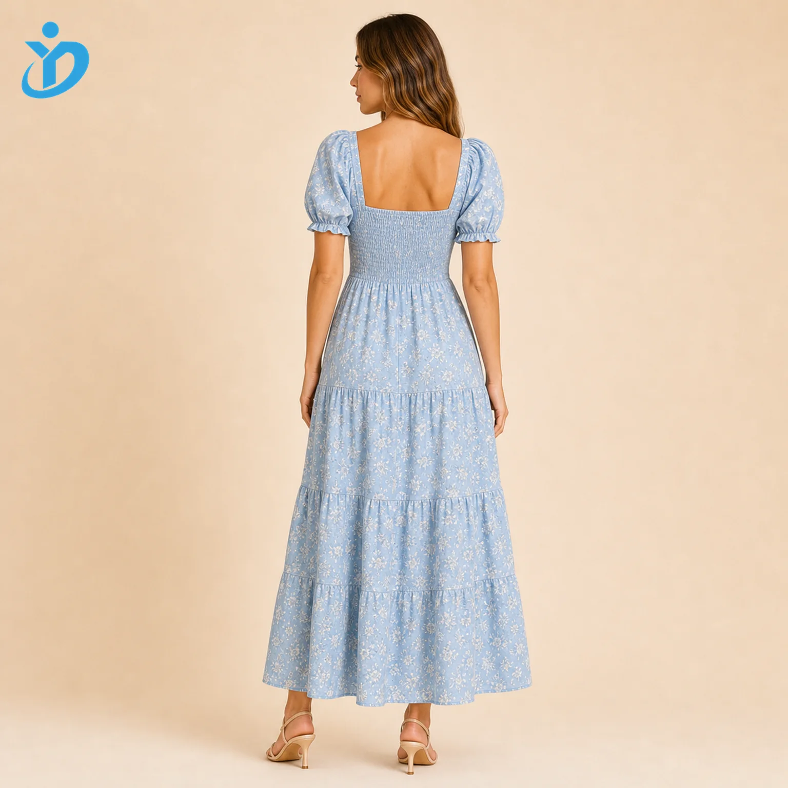 Custom womens blue floral tiered dress back view with smocked back puff sleeves tiered maxi skirt and Dongguan Yidi Clothing Co Ltd transparent logo