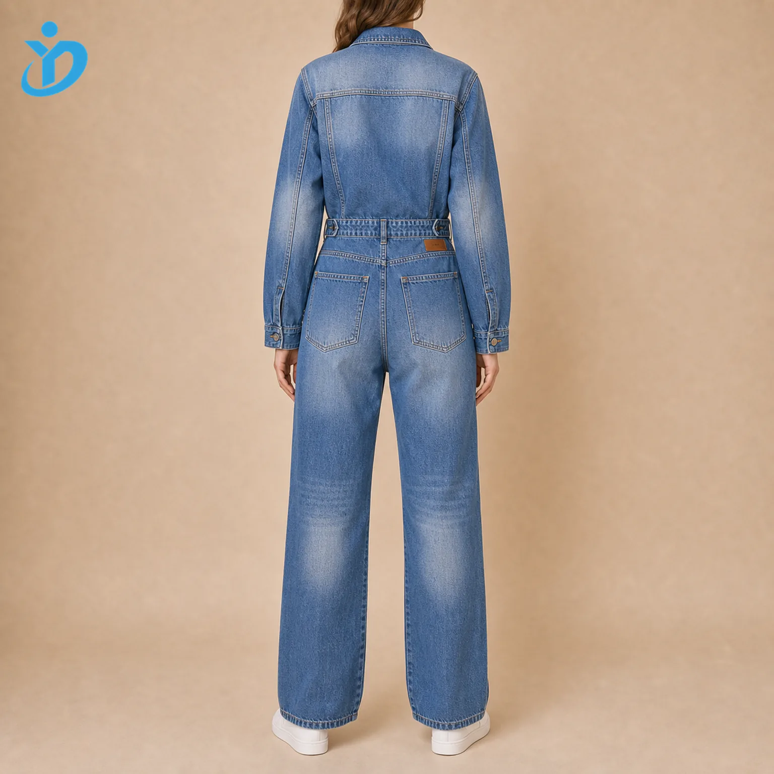 Custom womens denim boiler suit back view showing loose fit adjustable waist straight leg back pockets garment wash sand blasting white sneakers and Dongguan Yidi Clothing Co Ltd transparent logo