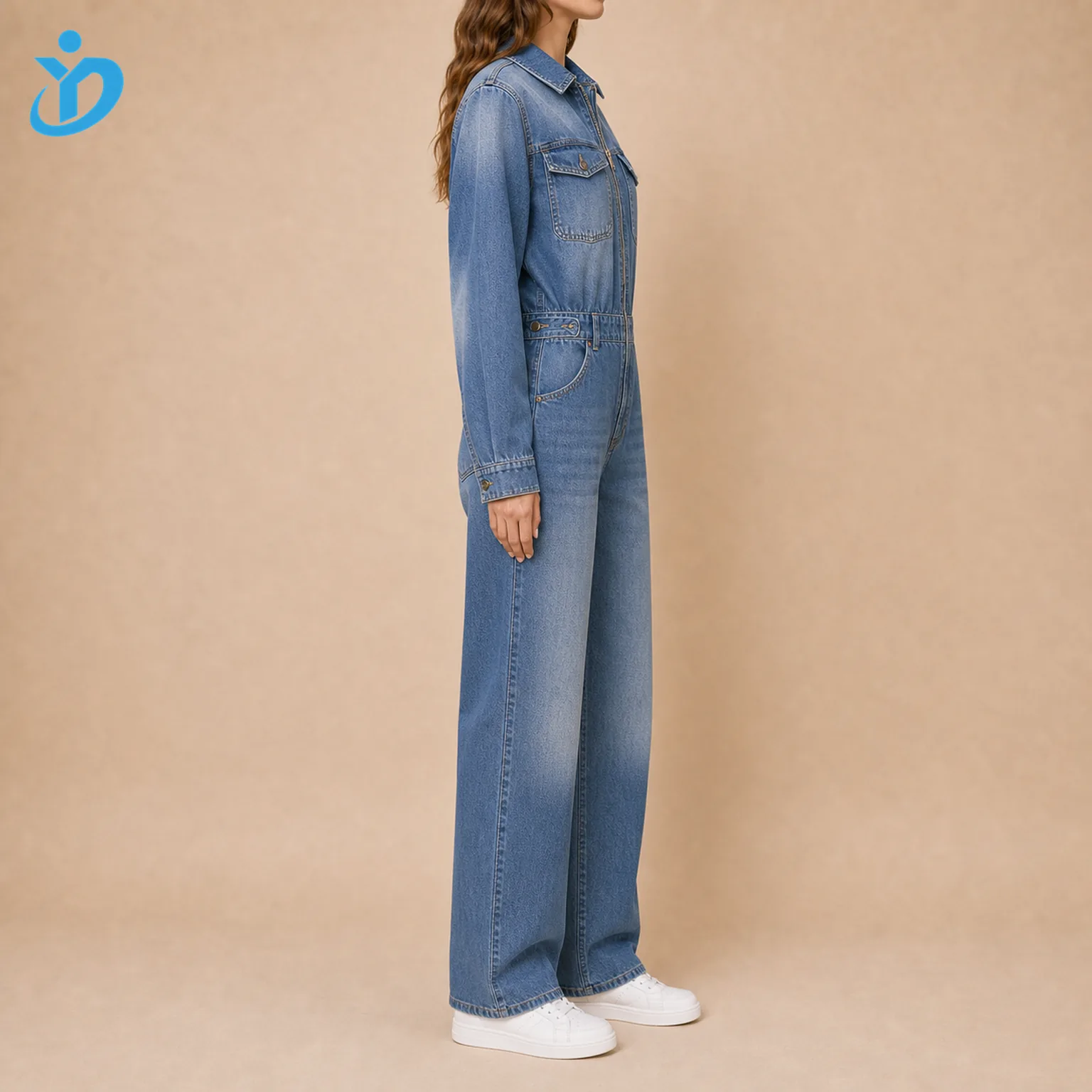 Custom womens denim boiler suit side view showing loose fit front zip adjustable waist straight leg chest pocket sand blasting white sneakers and Dongguan Yidi Clothing Co Ltd transparent logo