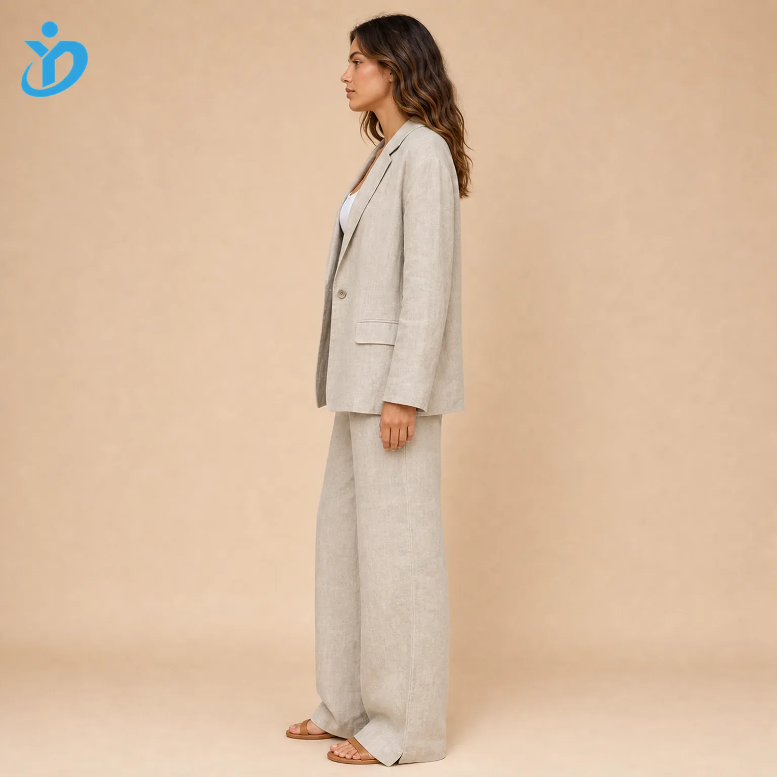 Custom womens linen suit sets side view showing natural beige linen blazer wide leg pants garment dyed enzyme washed fabric natural wrinkle finish and Dongguan Yidi Clothing Co Ltd transparent logo