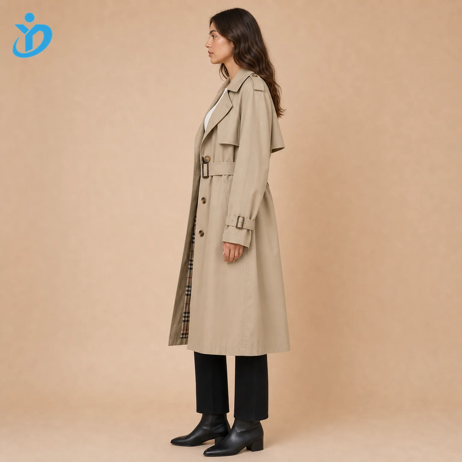 Custom womens oversized long trench coat side view showing water repellent coating custom lining metal buttons belt shoulder epaulettes and Dongguan Yidi Clothing Co Ltd transparent logo