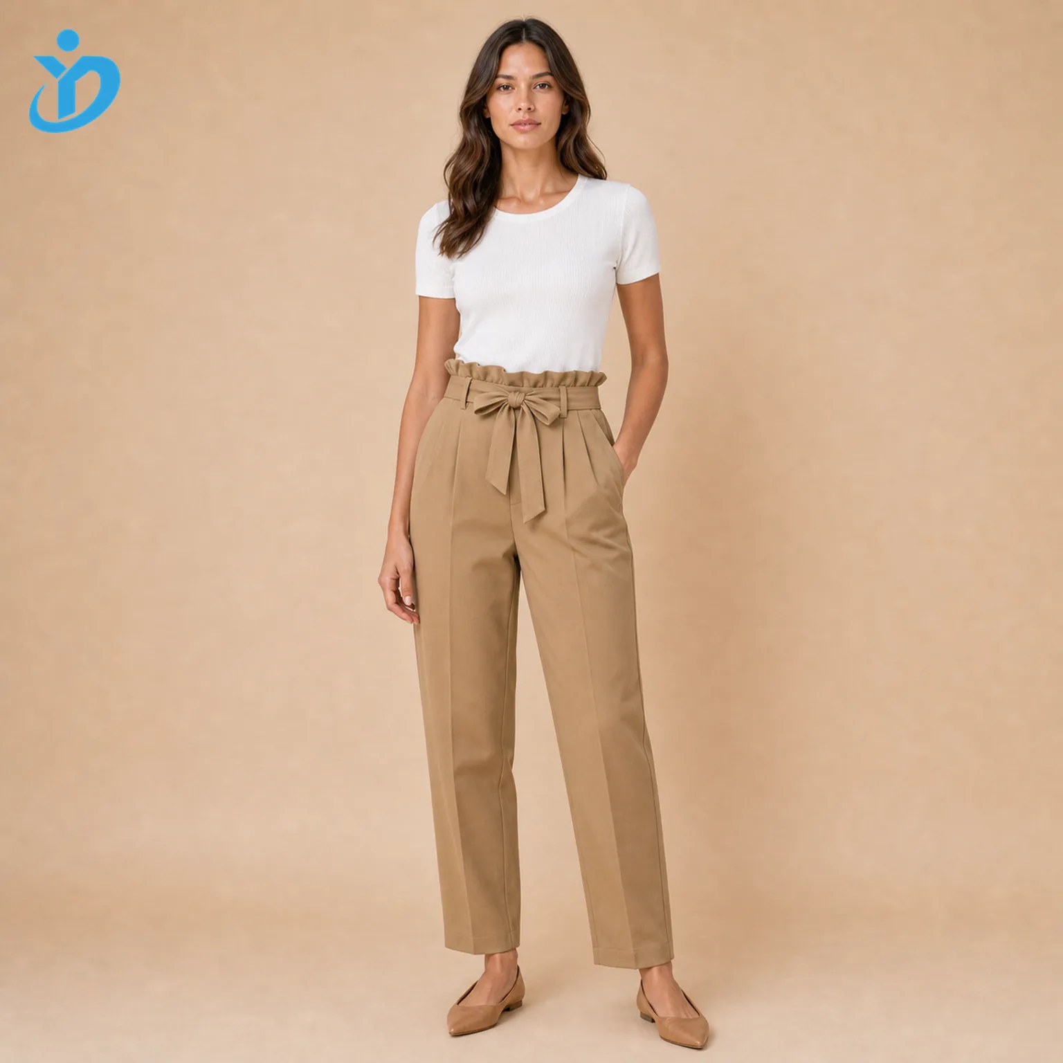 Custom womens paperbag waist pants front view with camel paperbag waist self fabric belt elastic waist front pleats tapered leg side pocket and Dongguan Yidi Clothing Co Ltd transparent logo