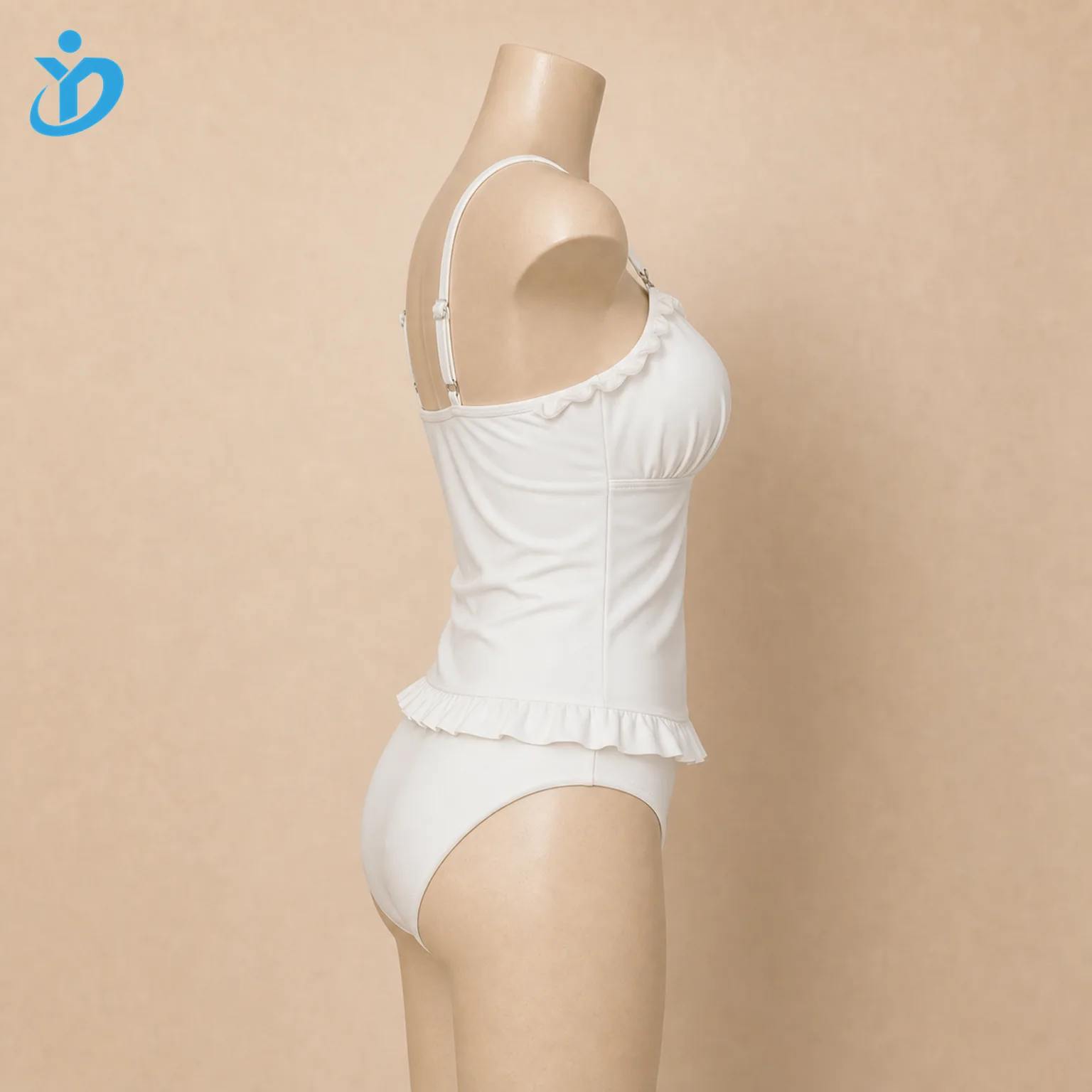 Custom womens ruffle tankini two piece swimsuit side view on mannequin showing long top ruffle hem adjustable straps high waist bottom and Dongguan Yidi Clothing Co Ltd transparent logo