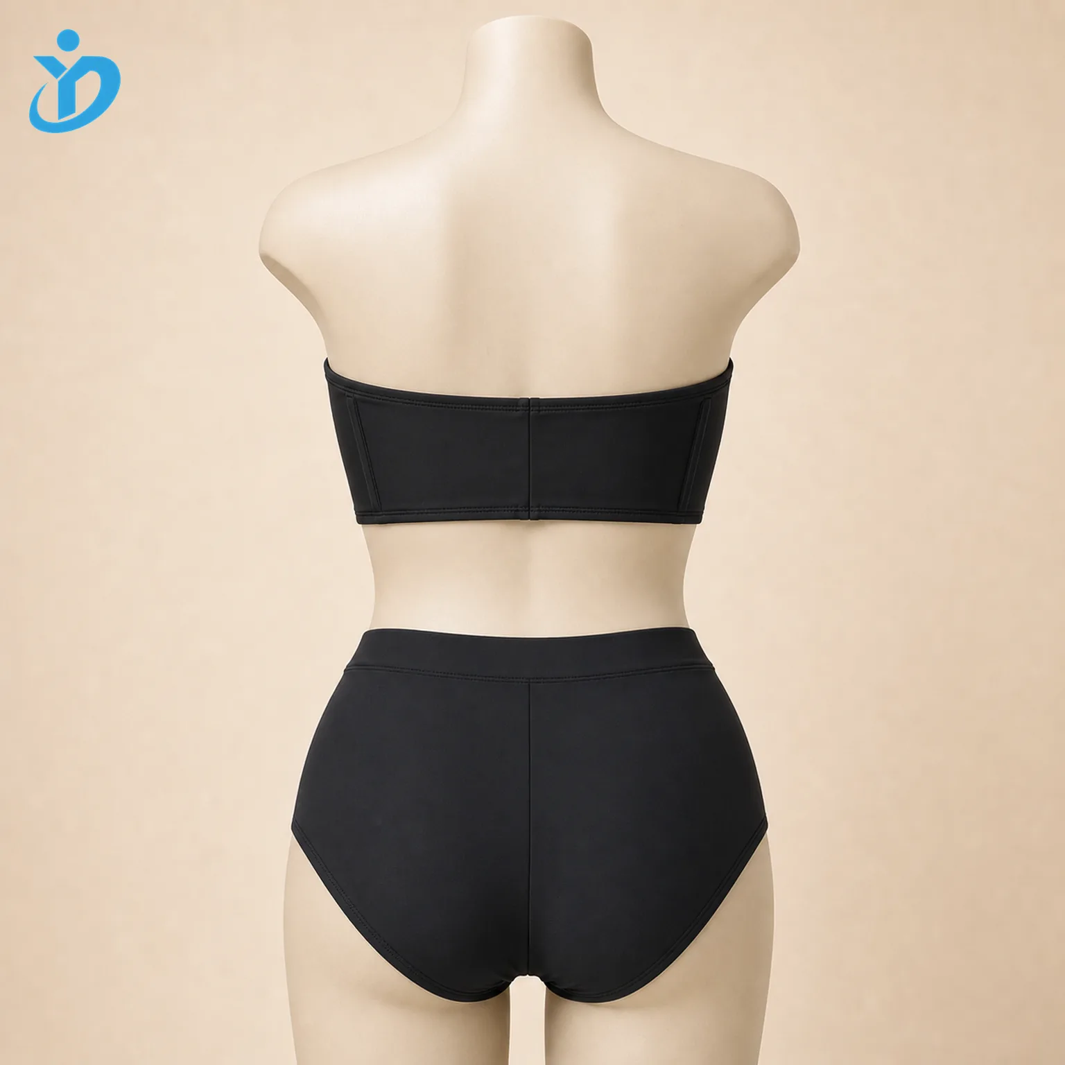 Custom womens strapless ring bandeau bikini set back view on mannequin showing strapless back band full coverage bottom and Dongguan Yidi Clothing Co Ltd transparent logo