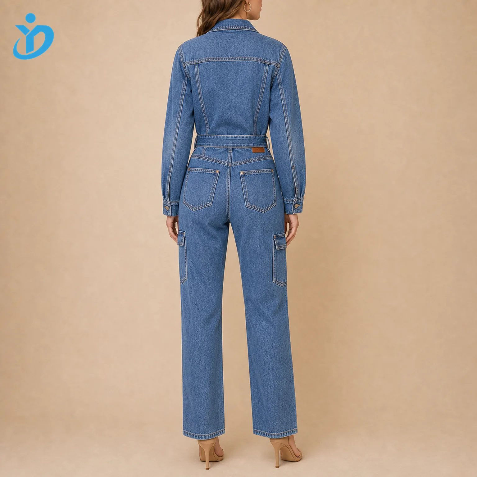 Custom womens utility denim jumpsuit back view showing waist belt back pockets straight leg custom leather patch bartack reinforcement and Dongguan Yidi Clothing Co Ltd transparent logo