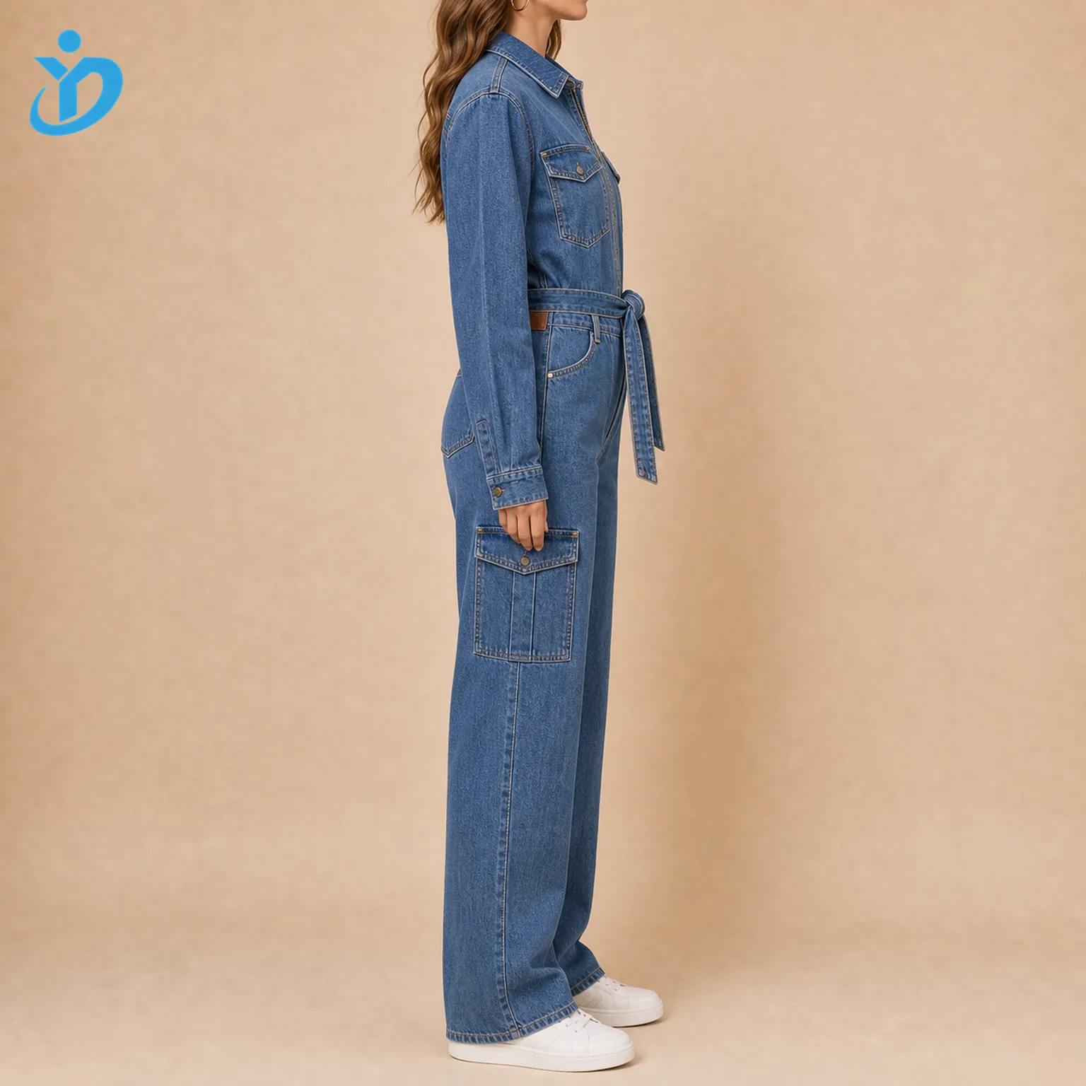 Custom womens utility denim jumpsuit side view showing cargo pockets waist belt straight leg garment wash metal zipper rivets and Dongguan Yidi Clothing Co Ltd transparent logo